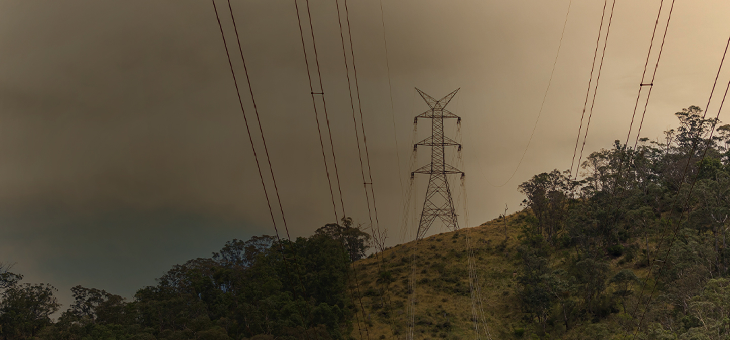 Electricity pole on a hill